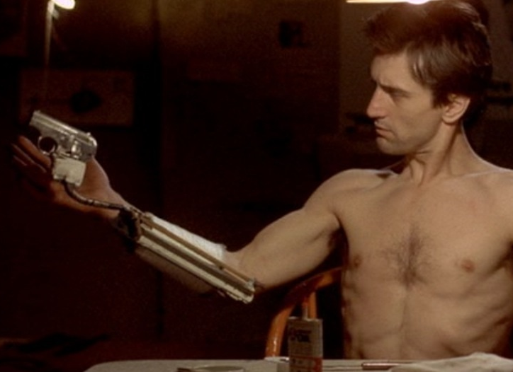Shot from Taxi Driver of the device Travis rigs up to hide a gun in his sleeve and slide it out when he wants to use it.